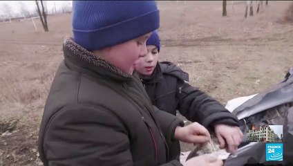 On the one hill with mobile signal, Ukrainian kids build makeshift classroom