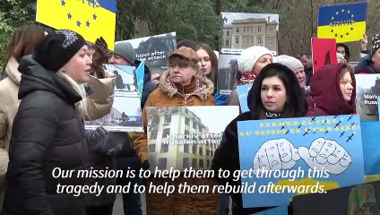 Protesters gather outside the Council of Europe demanding more EU support for Ukraine
