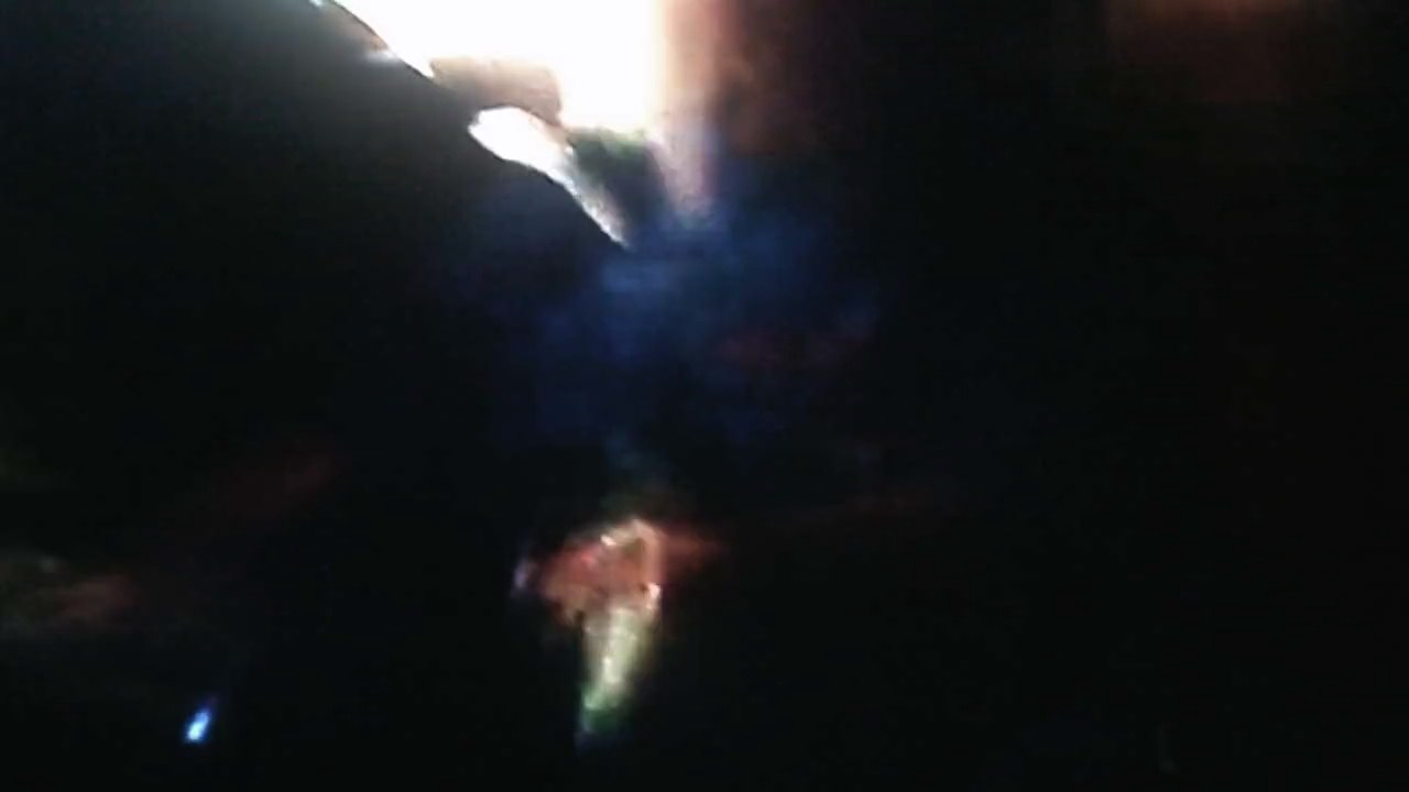 Christopher playing the wii while Jonathan watches & Anthony beats me up