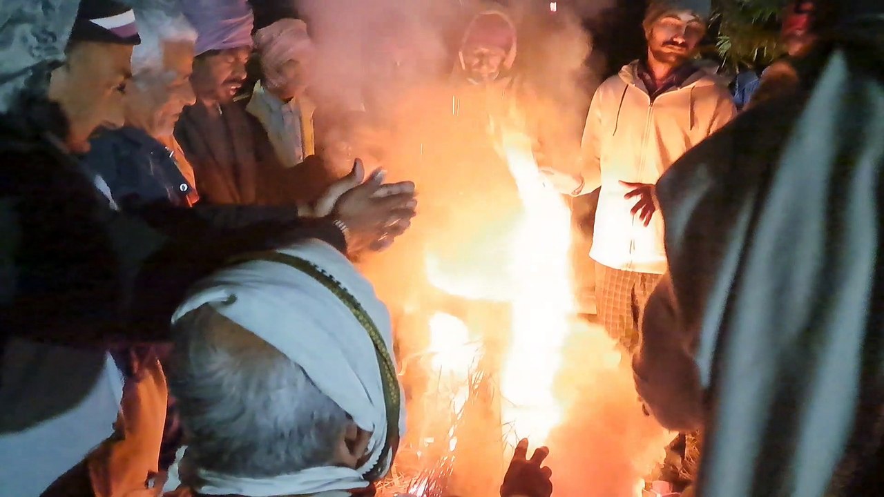 India countryside people keeping warm in cold winter night