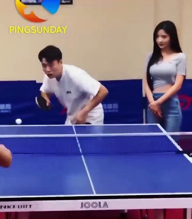 beautiful girl watching you playing table tennis