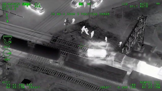 Moment officers pull suspect from stolen police car seconds before train crashes into vehicle