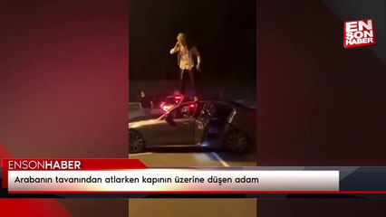 Arabanın tavanından atlarken kapının üzerine düşen adam