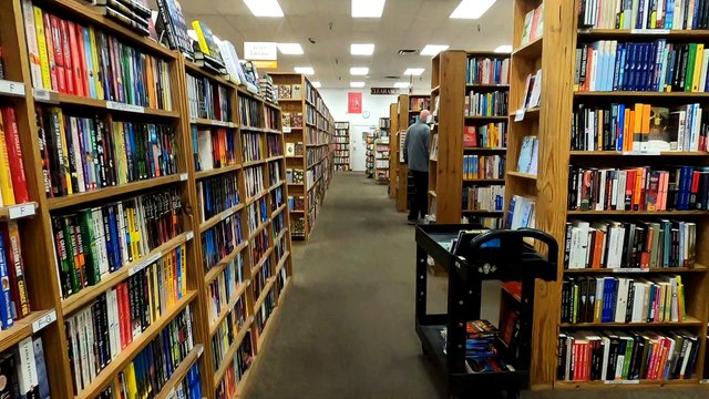 Walking through a used bookstore