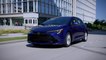 2023 Toyota Corolla SE Hatchback Blue Crush Metallic Driving in the city