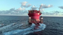 Greenpeace activists in inflatable boats approaching Shell platform