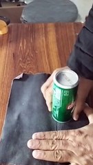 Easy homemade pen stand using a 7up can and flowers bracelet.