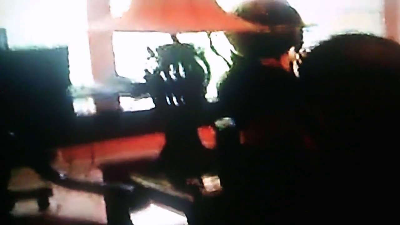 Christopher plays the wii while Jonathan & Anthony watch