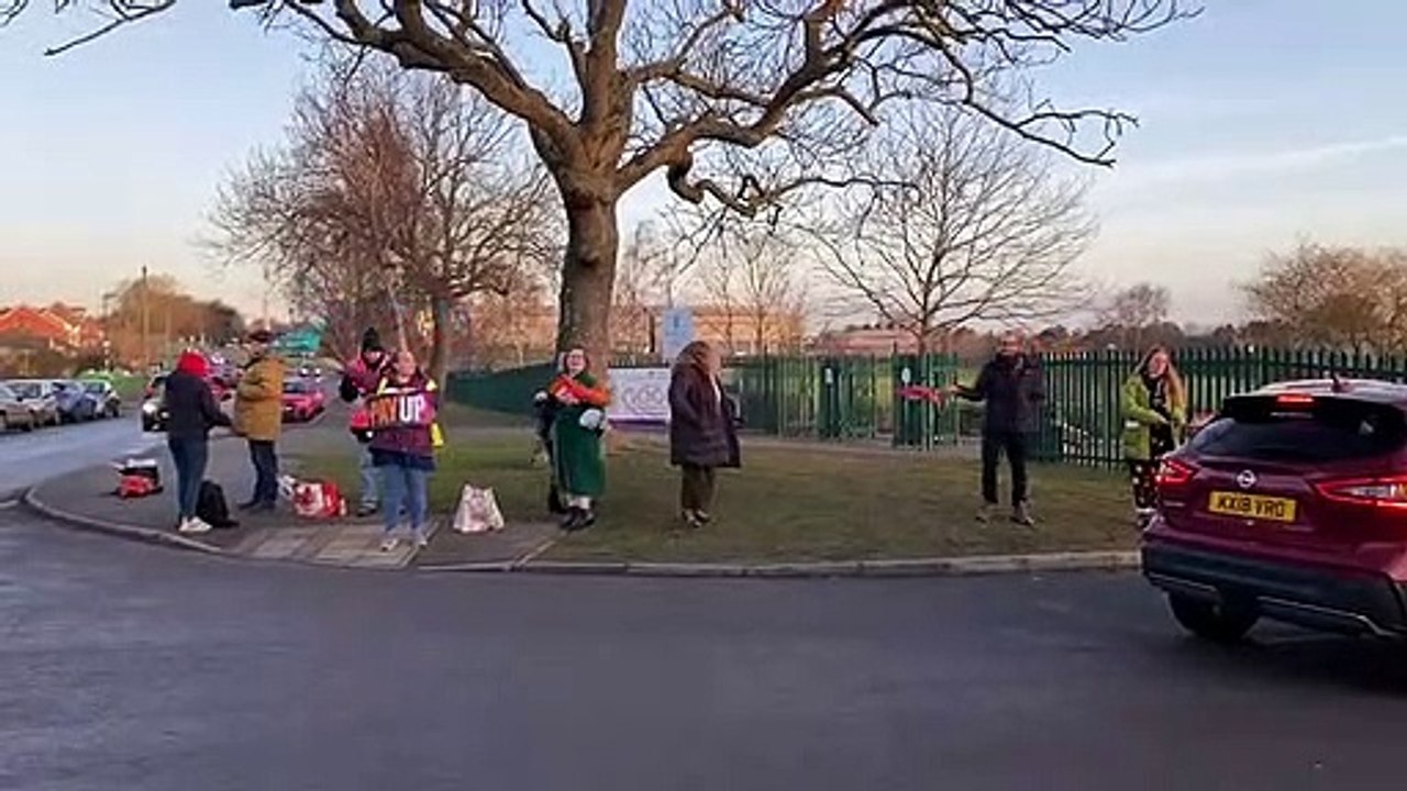 Teachers outside Weston Favell Academy
