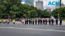 Tensions thick as police eye protesters in Hyde Park across from George Pell's funeral