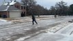 Texas resident ice skates down frozen street during cold snap
