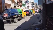 A vehicle full of garbage broke down, tied to a sari and pulled