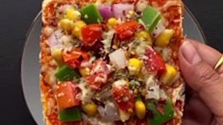 Cheesy bread toast recipe--_Do try it and save for later☺️❤️_Ingredients for cheese bread toast recipe__Bread slices _Grated mozzarella cheese 1_2 cup _Pizza sauce 1 tbsp _Onion 1_2 _Capsicum 1_2 _Sweet corn 1_4 cup _Tomato 1_2 _Butt(