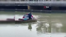 Nehre düşen araçtaki sürücüyü çevredekiler kurtardı
