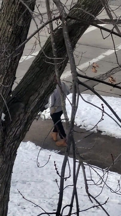 Man Circles Apartment Building With Firearm