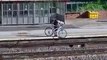Moment youngster dumps bicycle onto railway tracks on busy Leeds line