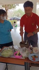 Teaching student how to make "Somtam" or (Green Papaya Salad)