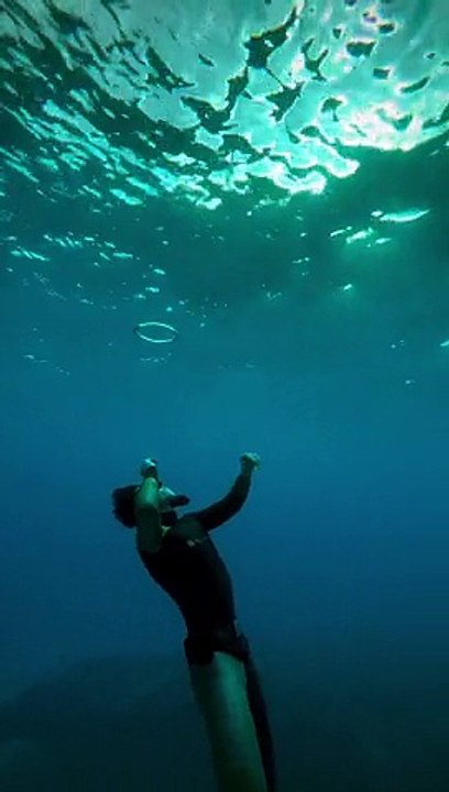 Diver Blows Bubble Rings