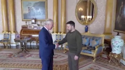Volodymyr Zelensky shakes hands with King Charles on surprise visit to Buckingham Palace