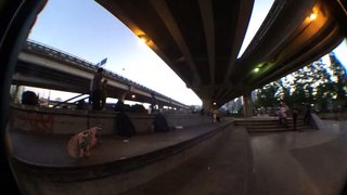 Skateboarder attempts to kickflip from ledge and lands on his head