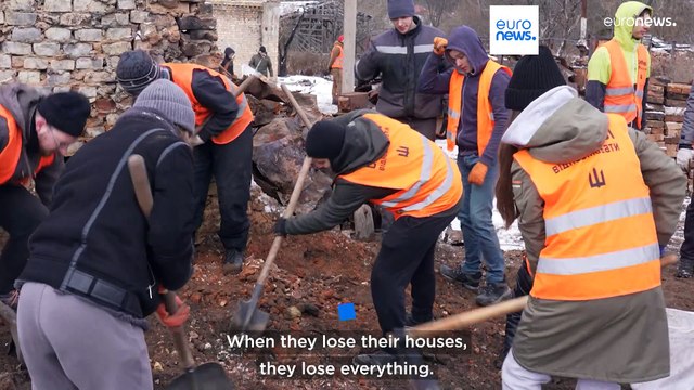Young Ukrainians rebuild destroyed homes in the village of Horenka