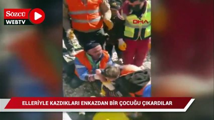 下载视频: Elleriyle kazdıkları enkazdan bir çocuğu çıkardılar