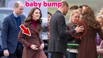 Prince William tenderly supports Kate as she holds her baby bump during a visit to Cornwall