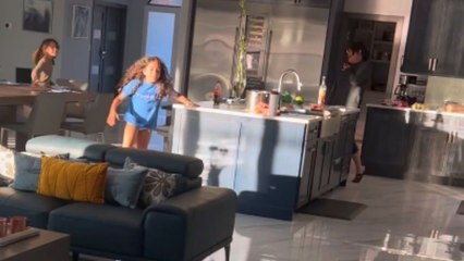 Excited twins start crying after elder sister flies in from halfway across the globe for their birthday