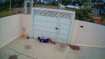 Boy Sneakily Squeezes Under Gate