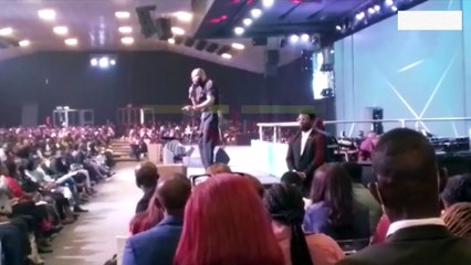 Abuja Pastor Mount Podium With AK-47