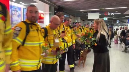 Скачать видео: Türkiye'den dönen Alman arama-kurtarma ekibi çiçeklerle karşılandı