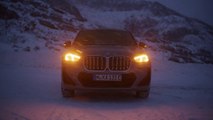BMW iX1 in Frozen Pure Grey Metallic drifting on ice
