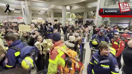 Almanya'ya dönen kurtarma ekibinin yollarına çiçekler serildi