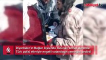 Diyarbakır polisi, enkaz alanında engelli vatandaşa elleriyle yemek yedirdi