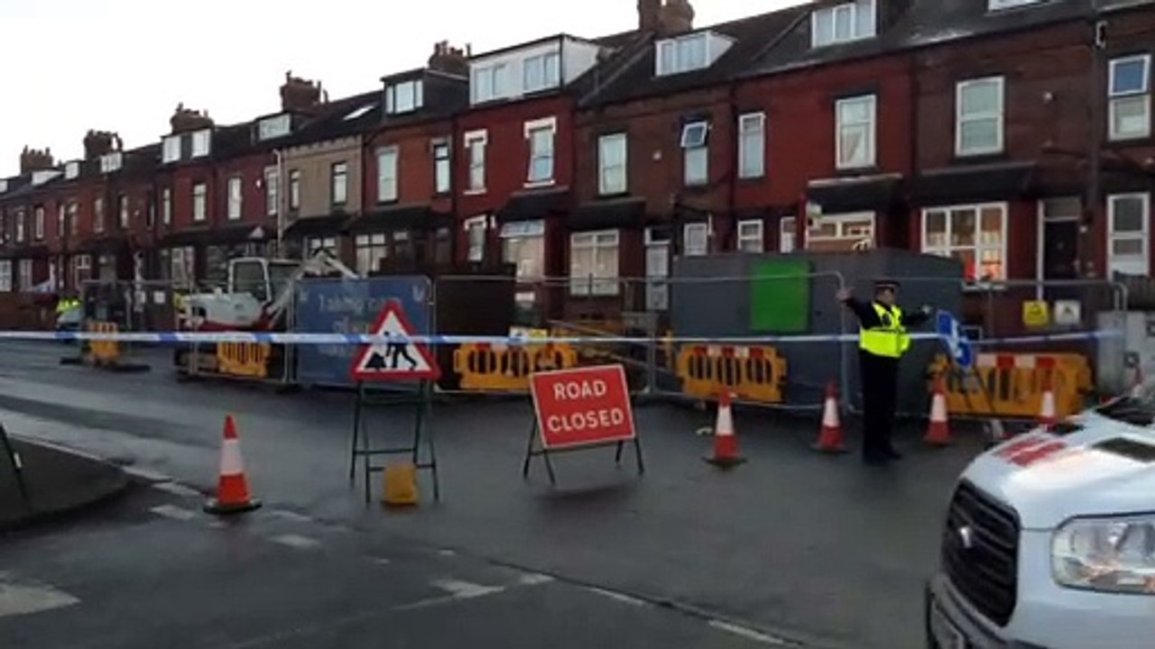Police seal off Compton Road in Harehills, Leeds, during ongoing incident
