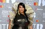 Lizzo 'looks happier than ever', insider reveals