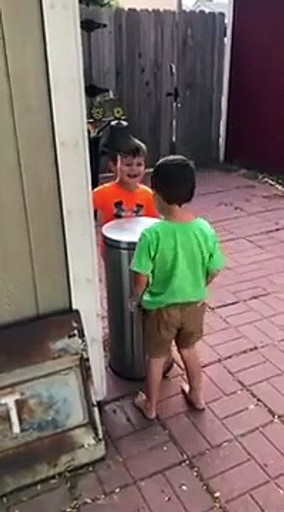Kids Jokingly Hit Each Other With Trash Can's Lid by Stepping on It's Pedal - 1069518