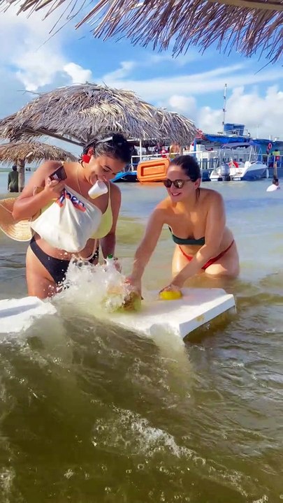 Friends Try to Keep Their Things From Floating Away