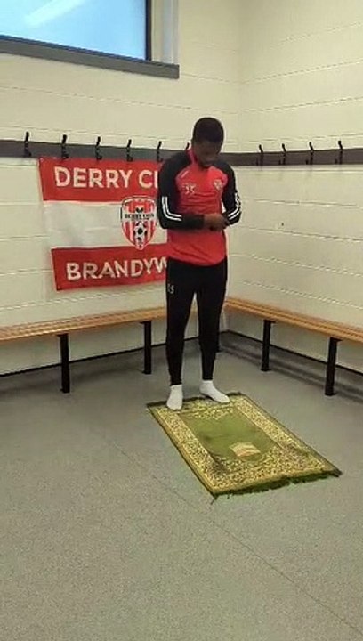 Derry City footballer Sadou Diallo in prayer