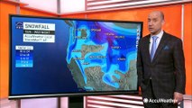 Arctic air, snow spread across western US