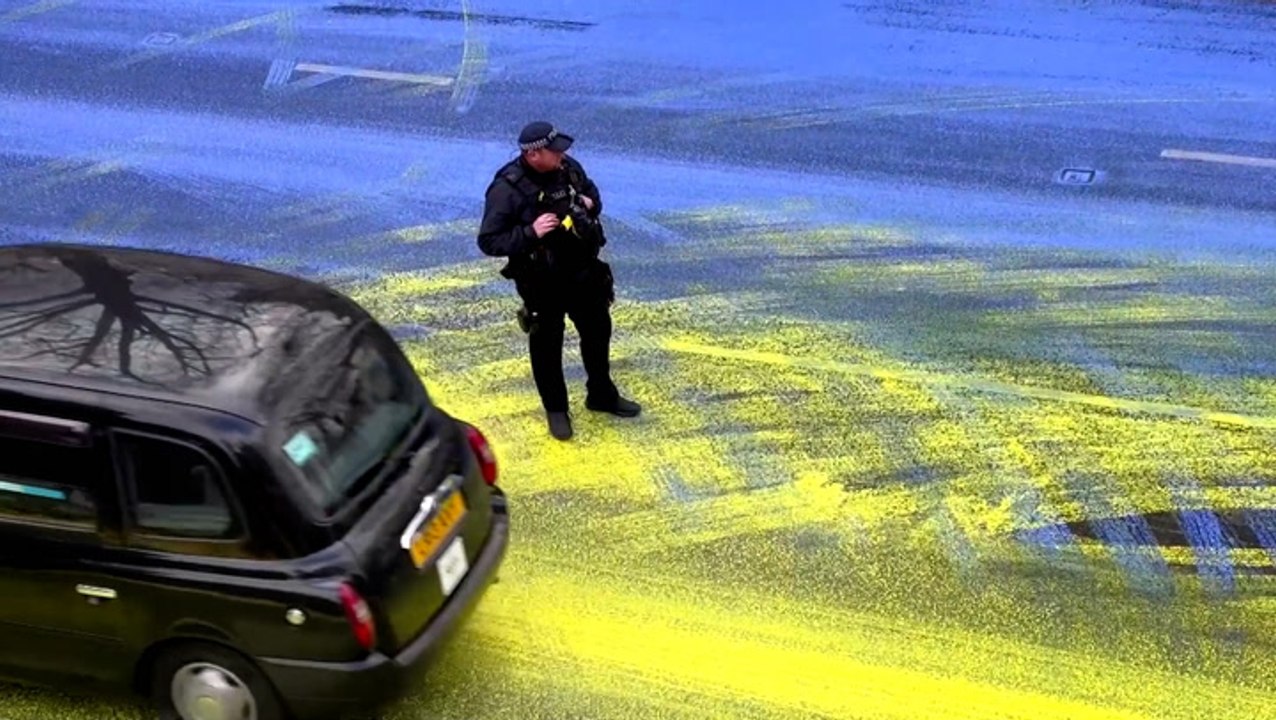 Giant Ukrainian flag painted on road outside Russian embassy in London