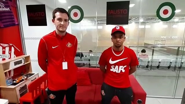 SAFC star Jewison Bennette enjoys a kick-about and Xbox challenge against children at the Beacon of Light