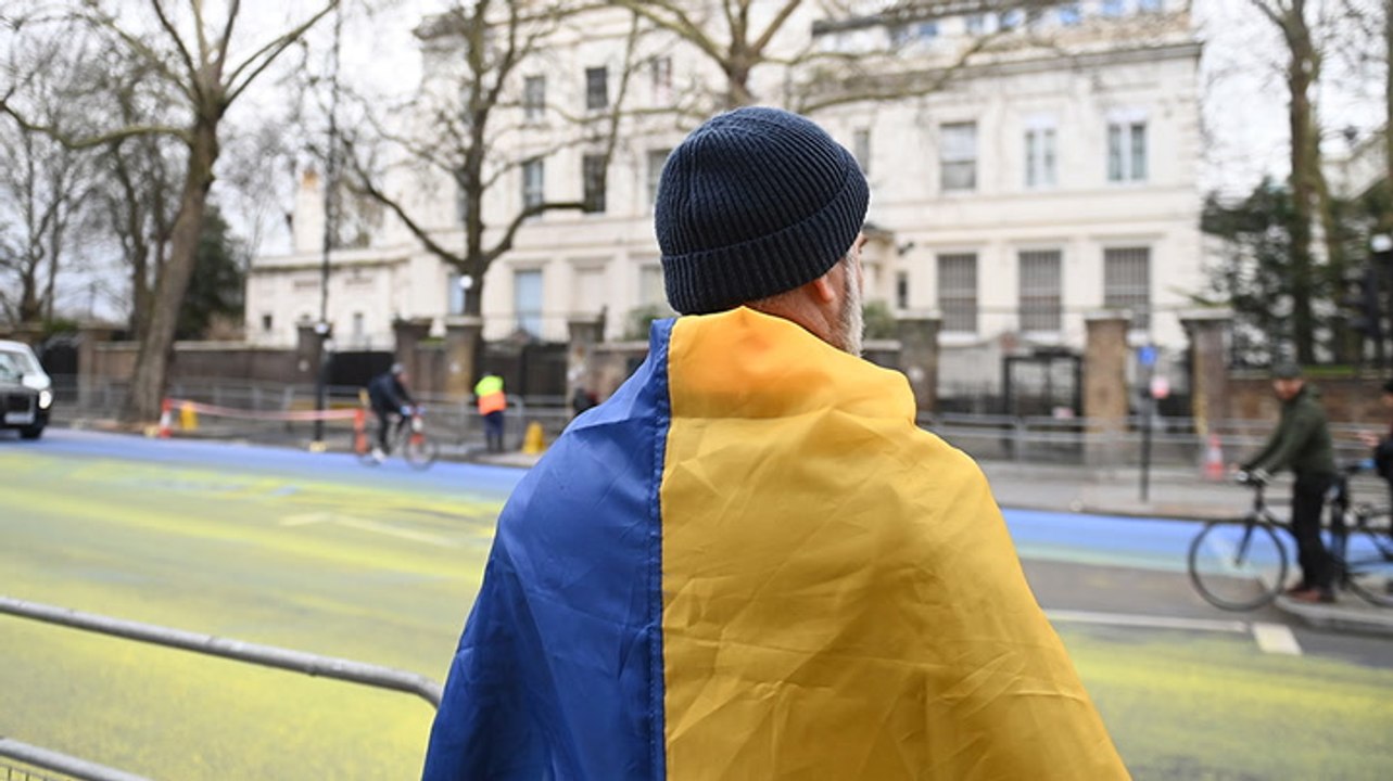 Four arrests after campaigners paint huge Ukrainian flag outside Russian embassy