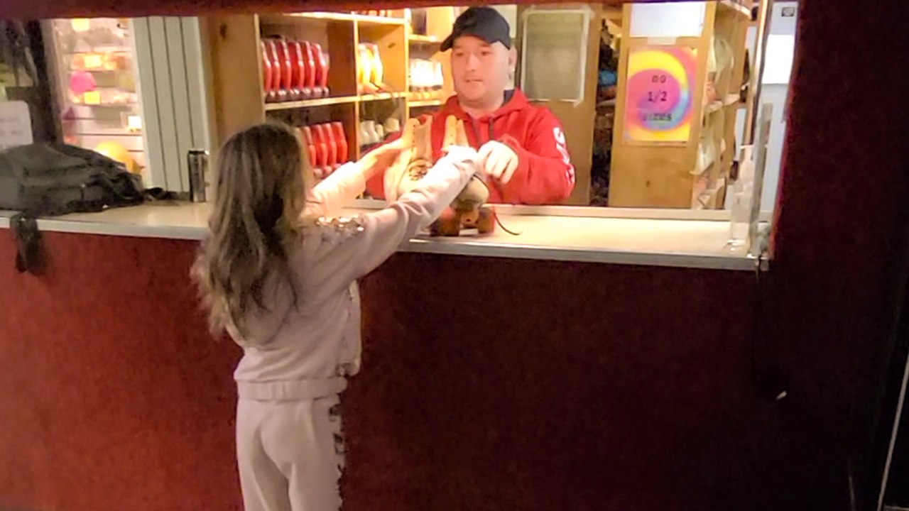 Birthday girl can't hide her joy after being surprised with a new pair of pink Rollerblades