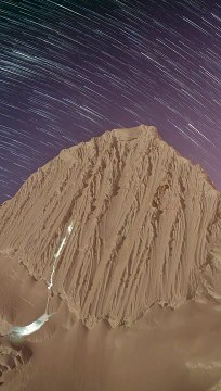 Time-Lapse Shows Mountaineers Climbing Under Starry Sky