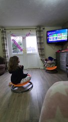 Girl Enjoys Spinning on Carousel