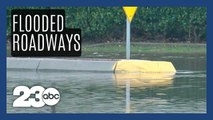Wild weather floods roads, closes highways