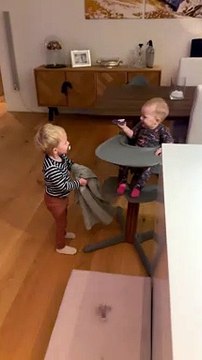 Baby Laughs at Older Brother Playing Peek-a-Boo