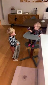 Baby Laughs at Older Brother Playing Peek-a-Boo