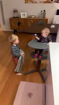 Baby Laughs at Older Brother Playing Peek-a-Boo